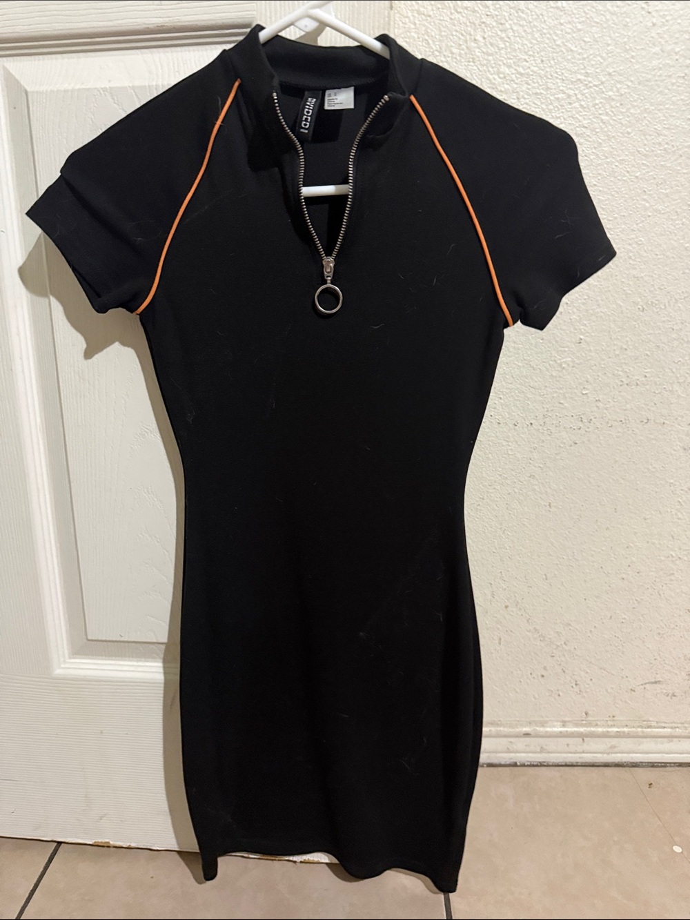 Divided Black Short-Sleeve Zip Tunic with Orange Piping
